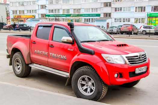 NOVYY URENGOY, RUSSIA - MAY 28, 2014: Motor car Toyota Hilux Arctic Trucks at the city street.