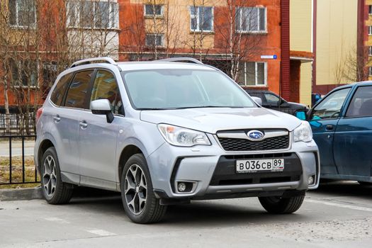 NOVYY URENGOY, RUSSIA - JUNE 11, 2014: Motor car Subaru Forester at the city street.