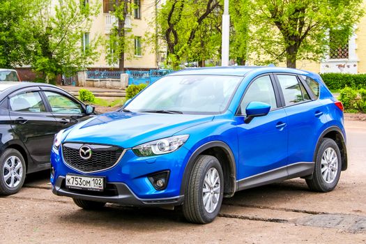 UFA, RUSSIA - MAY 3, 2012: Motor car Mazda CX-5 at the city street.