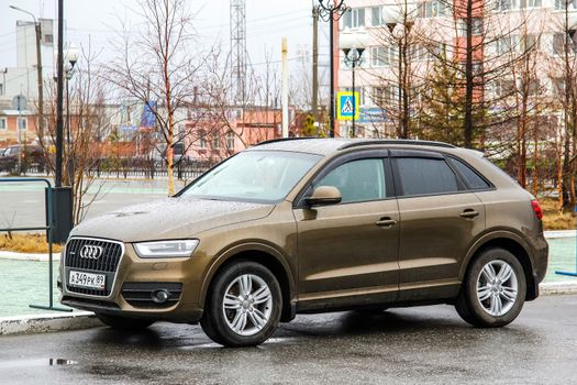 NOVYY URENGOY, RUSSIA - JUNE 2, 2014: Motor car Audi Q3 at the city street.