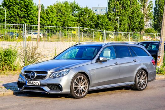 BERLIN, GERMANY - JULY 20, 2014: Motor car Mercedes-Benz S212 E-class at the city street.