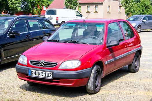 KOENIGSBRUECK, GERMANY - JULY 20, 2014: Motor car Citroen Saxo at the town street.