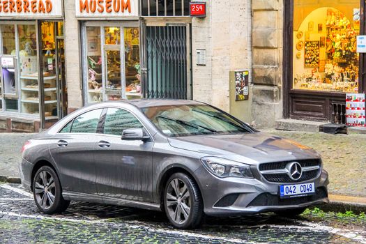 PRAGUE, CZECH REPUBLIC - JULY 21, 2014: Motor car Mercedes-Benz C117 CLA-class at the city street.