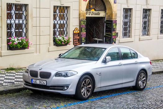 PRAGUE, CZECH REPUBLIC - JULY 21, 2014: Motor car BMW F10 5-series at the city street.