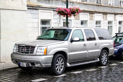 PRAGUE, CZECH REPUBLIC - JULY 21, 2014: Motor car Cadillac Escalade at the city street.