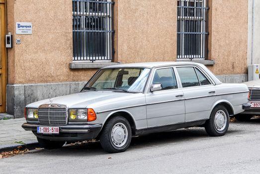 BRUSSELS, BELGIUM - AUGUST 9, 2014: Motor car Mercedes-Benz W123 E-class at the city street.