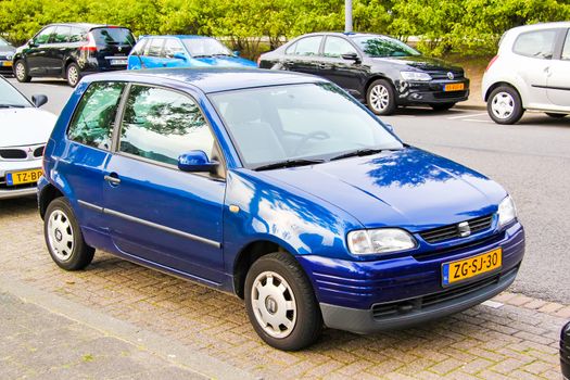 ROTTERDAM, NETHERLANDS - AUGUST 9, 2014: Motor car SEAT Arosa at the city street.