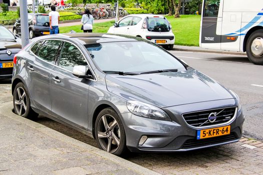 ROTTERDAM, NETHERLANDS - AUGUST 9, 2014: Motor car Volvo V40 at the city street.