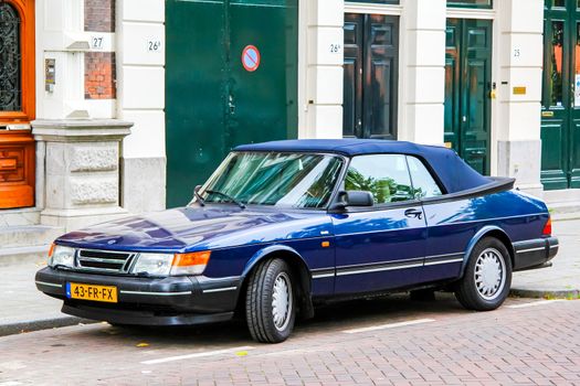 ROTTERDAM, NETHERLANDS - AUGUST 9, 2014: Motor car Saab 900 at the city street.