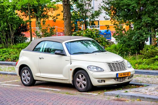 ROTTERDAM, NETHERLANDS - AUGUST 9, 2014: Motor car Chrysler PT Cruiser at the city street.