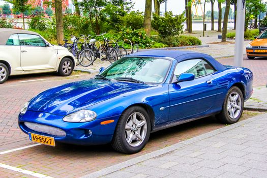 ROTTERDAM, NETHERLANDS - AUGUST 9, 2014: Motor car Jaguar XK at the city street.