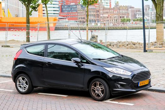 ROTTERDAM, NETHERLANDS - AUGUST 9, 2014: Motor car Ford Fiesta at the city street.