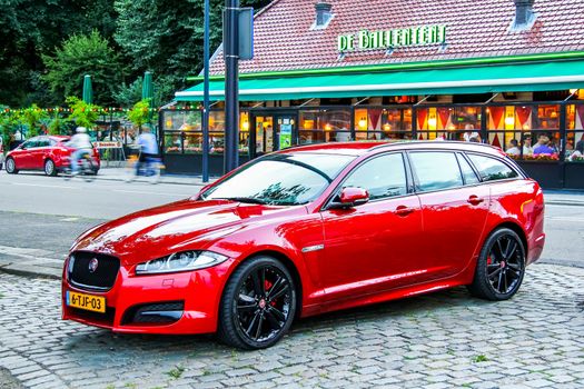 ROTTERDAM, NETHERLANDS - AUGUST 9, 2014: Motor car Jaguar XF at the city street.