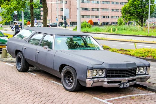 AMSTERDAM, NETHERLANDS - AUGUST 10, 2014: Motor car Chevrolet Townsman at the city street.