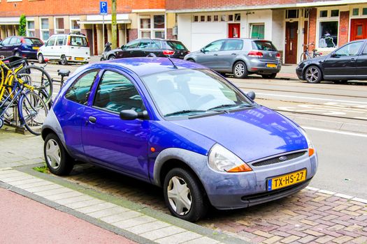 AMSTERDAM, NETHERLANDS - AUGUST 10, 2014: Motor car Ford Ka at the city street.