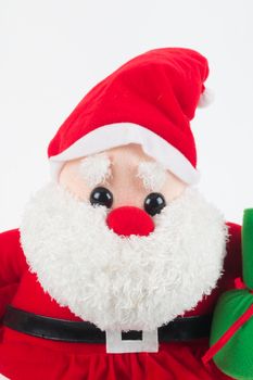 close up image of Santa Claus doll with green sack on white background