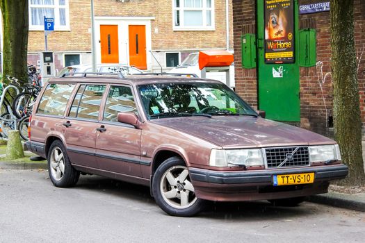 AMSTERDAM, NETHERLANDS - AUGUST 10, 2014: Motor car Volvo 900 Series at the city street.