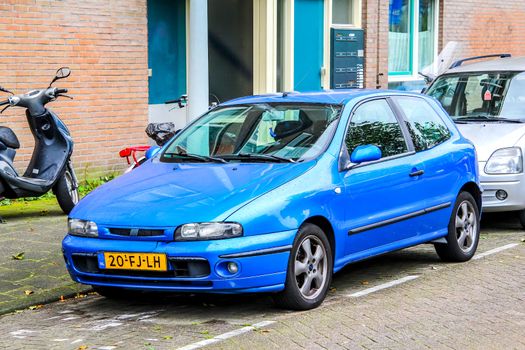 AMSTERDAM, NETHERLANDS - AUGUST 10, 2014: Motor car Fiat Bravo at the city street.