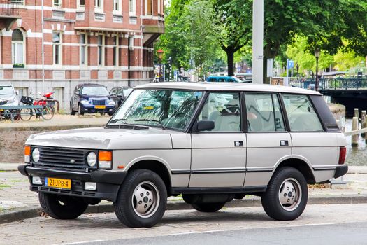 AMSTERDAM, NETHERLANDS - AUGUST 10, 2014: Motor car Range Rover Classic at the city street.