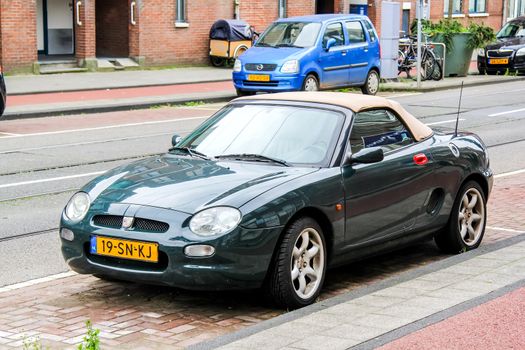 AMSTERDAM, NETHERLANDS - AUGUST 10, 2014: Motor car MG F at the city street.