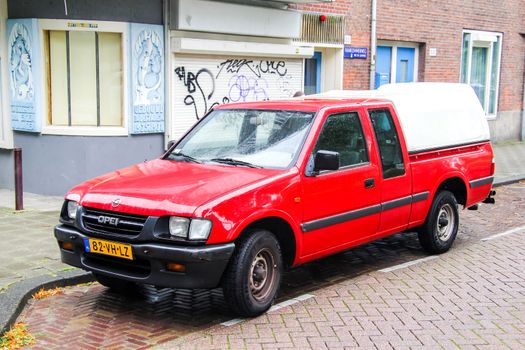 AMSTERDAM, NETHERLANDS - AUGUST 10, 2014: Motor car Opel Campo at the city street.