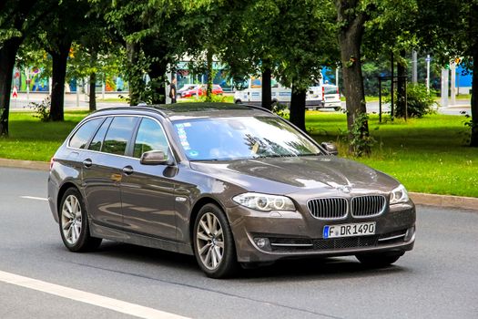 DRESDEN, GERMANY - JULY 21, 2014: Motor car BMW F11 5-series at the city street.