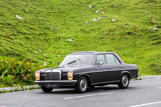 TYROL, AUSTRIA - JULY 29, 2014: Motor car Mercedes-Benz W115 E-class at the Grossglockner High Alpine road.