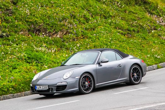 TYROL, AUSTRIA - JULY 29, 2014: Motor car Porsche 991 911 at the Grossglockner High Alpine road.
