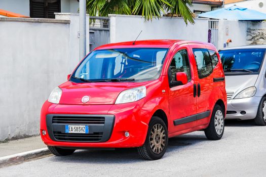 PISA, ITALY - JULY 31, 2014: Motor car Fiat Qubo at the city street.