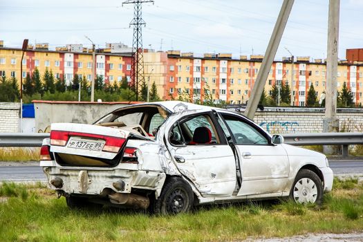 NOVYY URENGOY, RUSSIA - AUGUST 16, 2015: Crashed motor car Nissan Sunny at the city street.