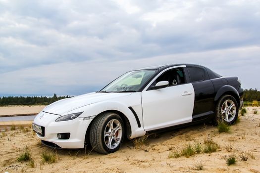 NOVYY URENGOY, RUSSIA - AUGUST 16, 2015: Motor car Mazda RX-8 at the countryside.