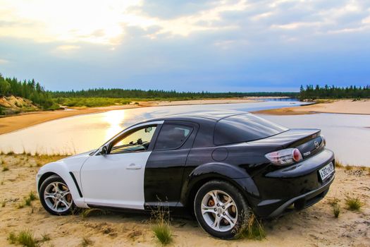 NOVYY URENGOY, RUSSIA - AUGUST 16, 2015: Motor car Mazda RX-8 at the countryside.