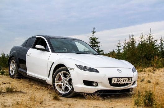 NOVYY URENGOY, RUSSIA - AUGUST 16, 2015: Motor car Mazda RX-8 at the countryside.