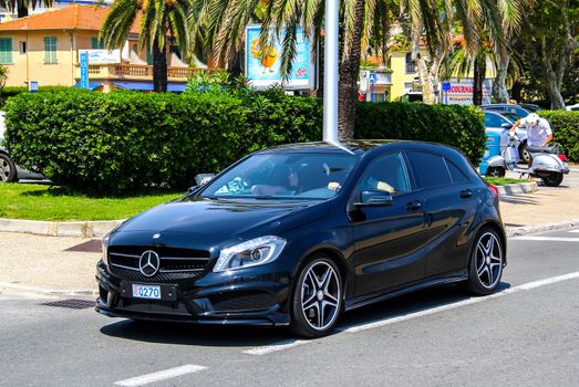 MENTON, FRANCE - AUGUST 2, 2014: Motor car Mercedes-Benz W176 A-class at the city street.