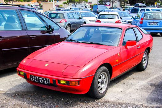 SAINT-TROPEZ, FRANCE - AUGUST 3, 2014: Motor car Porsche 924 at the city street.