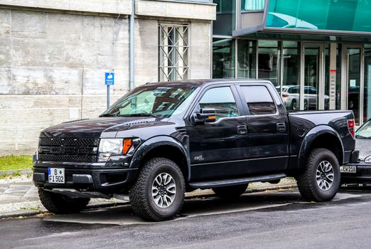 BERLIN, GERMANY - AUGUST 15, 2014: Motor car Ford F-150 Raptor at the city street.