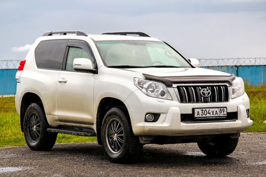 NOVYY URENGOY, RUSSIA - JULY 16, 2015: Motor car Toyota Land Cruiser Prado 150 at the city street.