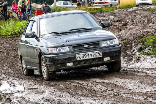 ASHA, RUSSIA - JULY 18, 2015: Motor car Lada 2112 at the country dirt road.