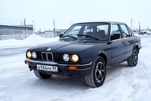 PANGODY, RUSSIA - DECEMBER 1, 2012: Motor car BMW E30 324d at the city street.