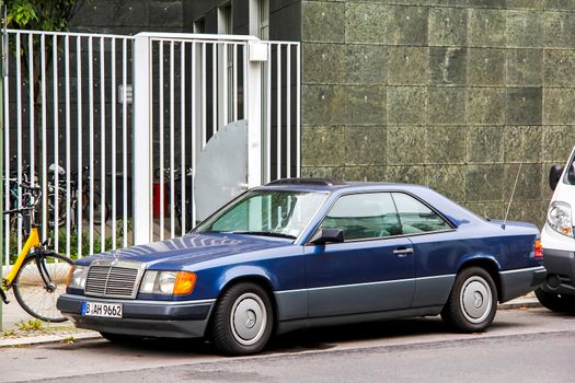 BERLIN, GERMANY - SEPTEMBER 12, 2013: Motor car Mercedes-Benz C124 E-class at the city street.