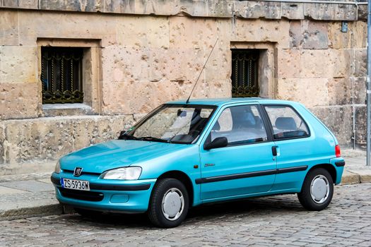 BERLIN, GERMANY - SEPTEMBER 12, 2013: Motor car Peugeot 106 at the city street.