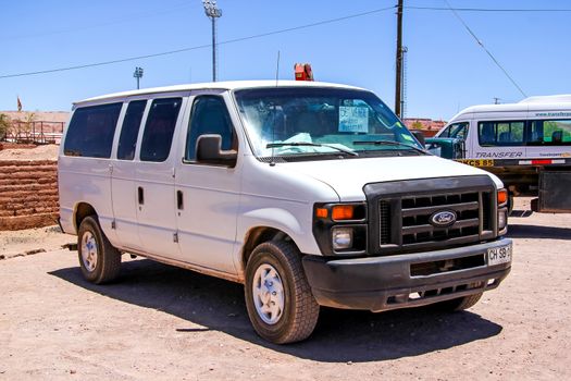 SAN PEDRO DE ATACAMA, CHILE - NOVEMBER 17, 2015: White van Ford E-series at the town street.