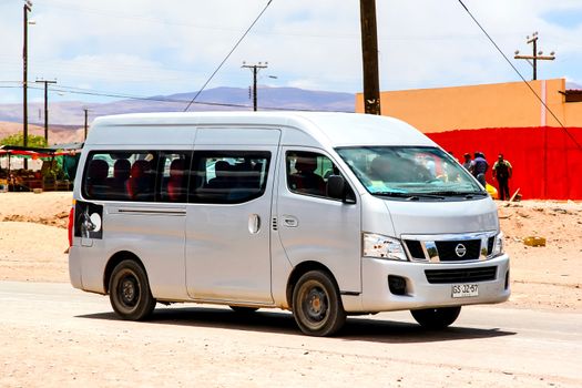 SAN PEDRO DE ATACAMA, CHILE - NOVEMBER 15, 2015: Compact bus Nissan Caravan at the countryside.