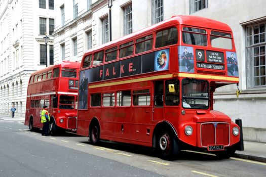 Two old red London buses