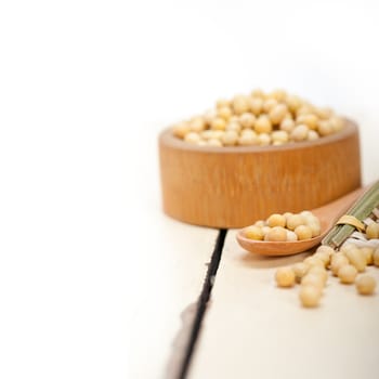 organic soya beans over rustic wood table macro closeup