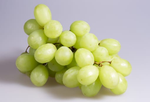 Green Grapes Close Up on grey background.