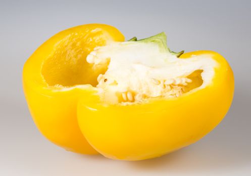 Sliced Yellow Bell Pepper close up on grey background.