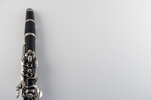 Black clarinet closeup on white background