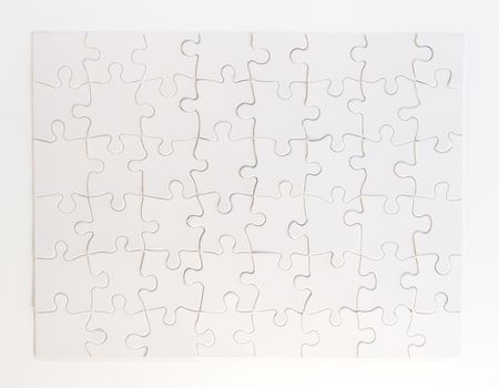 Completed white jigsaw puzzle on white background