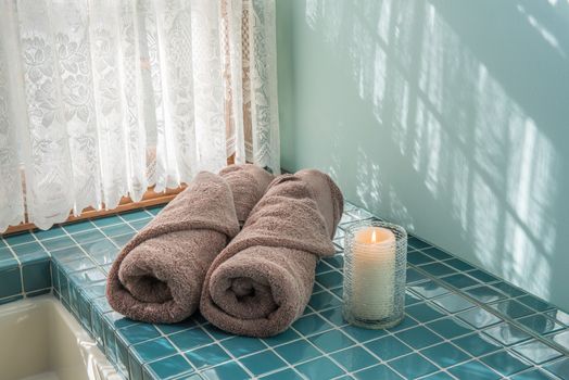 Master bath luxury towels and lit candle